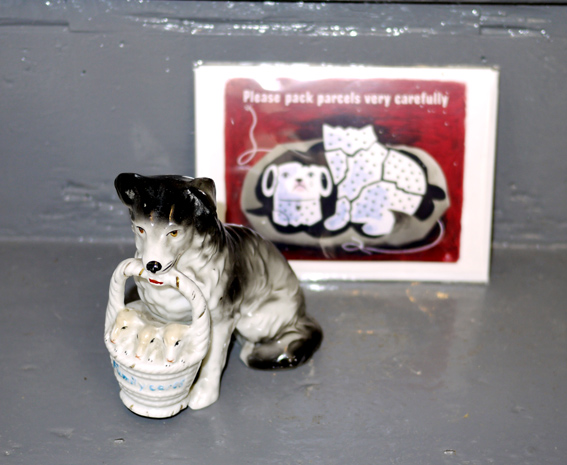 Souvenir porcelain sheepdog with pups in basket 'family cares'